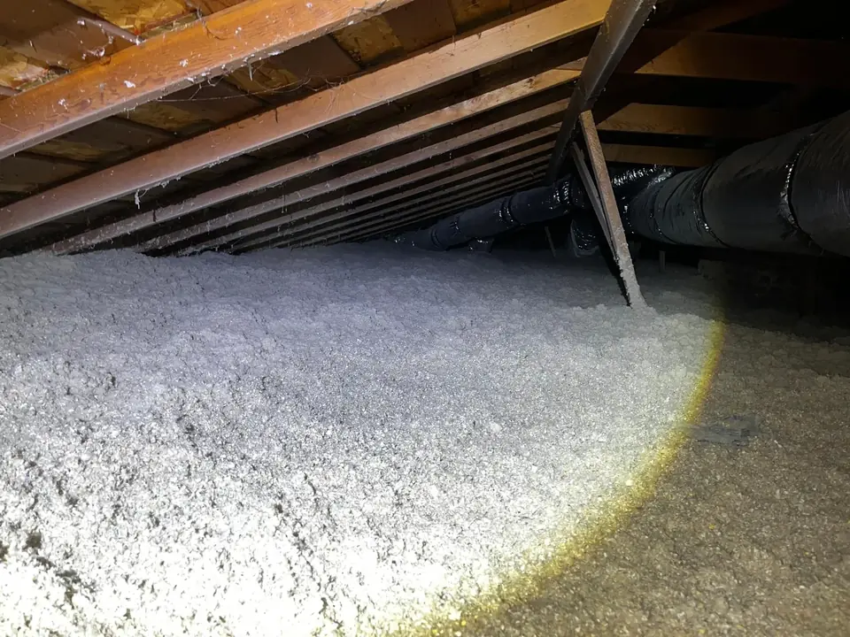 Clean attic after old insulation and debris were removed and new insulation added