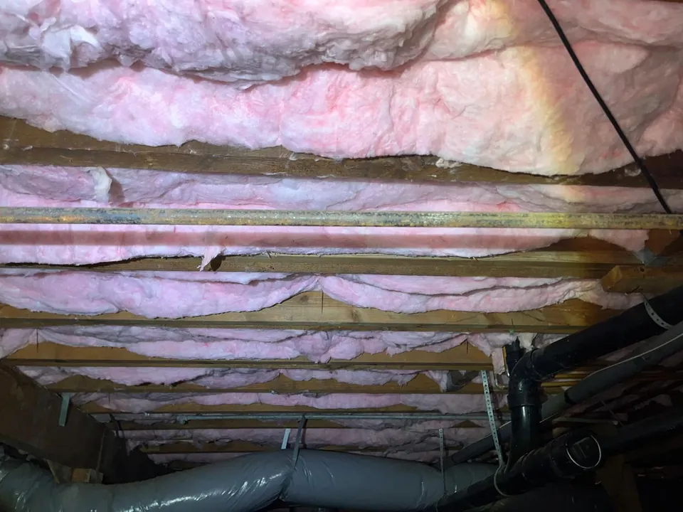 Batt insulation fitted between the joists